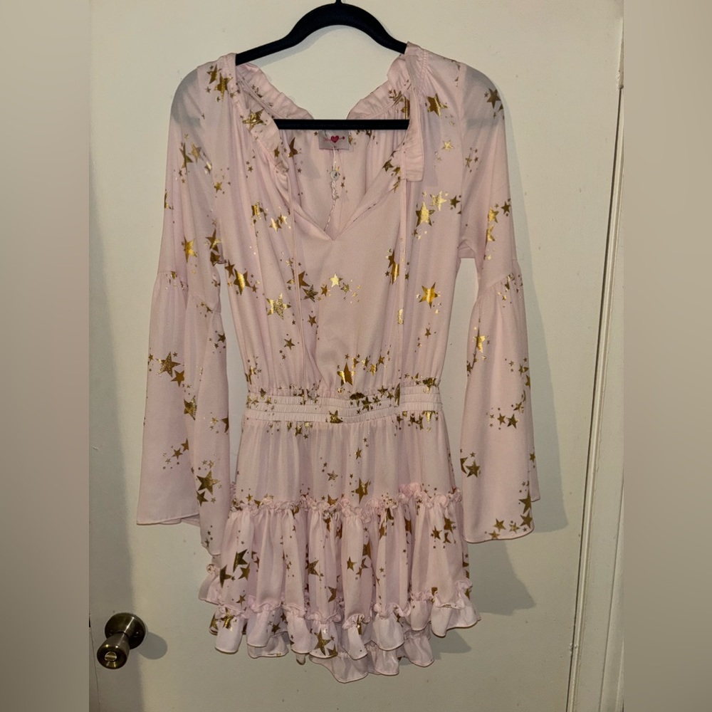 The CUTEST pink with stars Buddy Love ruffle dress.
